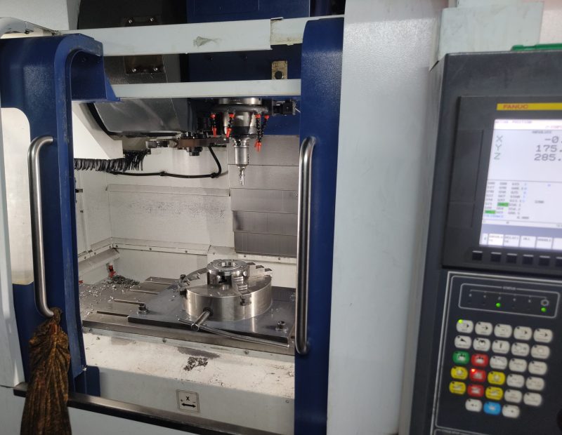 A precision vertical machining center in a scaled-down model.