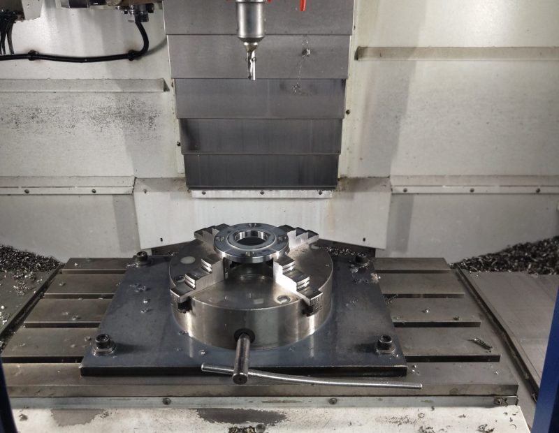 A precision vertical machining center in a scaled-down model.